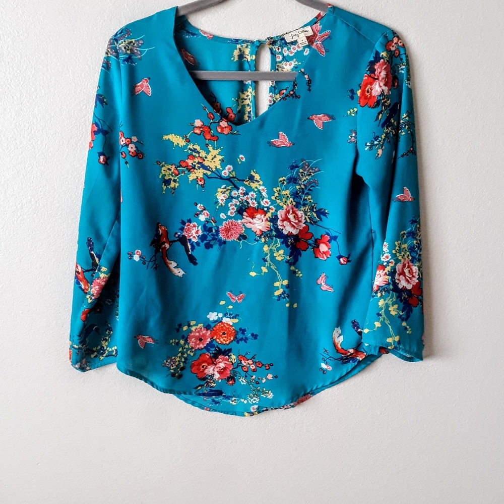 Pretty Lily White floral blouse.